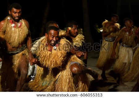 Group of Indigenous Fijian men dancing a traditional male dance meke wesi the spear dance. Real people. Copy space Royalty-Free Stock Photo #606055313