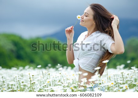 Woman in a field with flowers