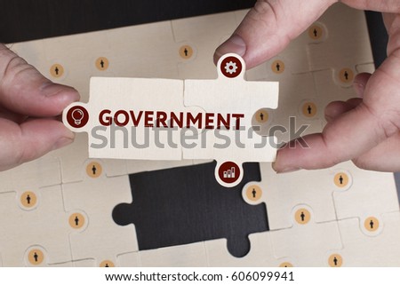 Business, Technology, Internet and network concept. Young businessman shows the word: Government