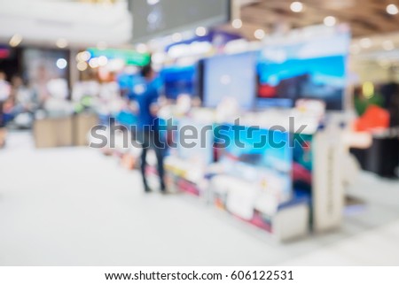 Television shelf in eletronic department store blurred background