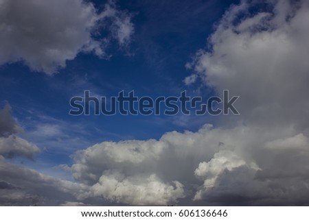 Clouds in the blue sky over the city