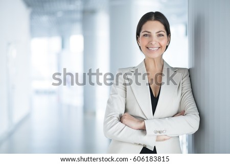 Happy Pretty Business Woman Standing in Hall