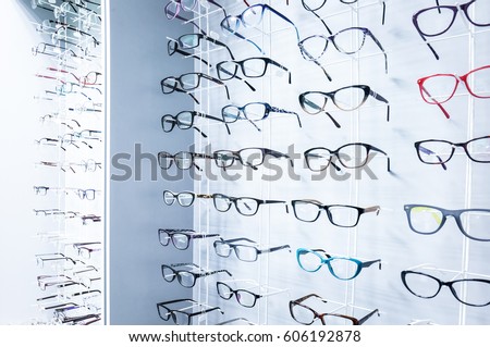 Showcase with glasses in modern optic store Royalty-Free Stock Photo #606192878