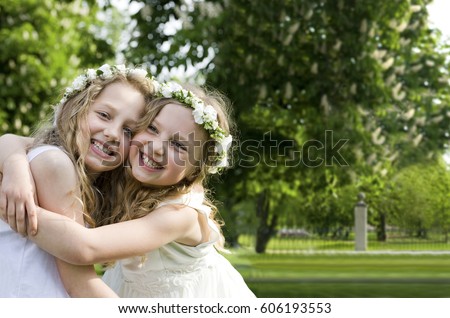 Happy girlfriends - First Communion Royalty-Free Stock Photo #606193553
