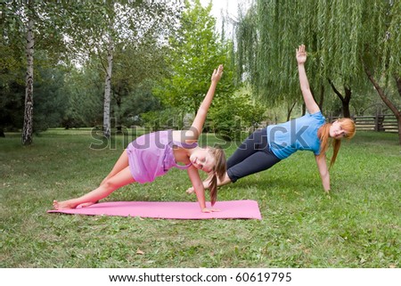 mother and daughter engage in fitness