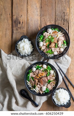 Thai style noodle soup , Boat culture noodles style. Royalty-Free Stock Photo #606250439