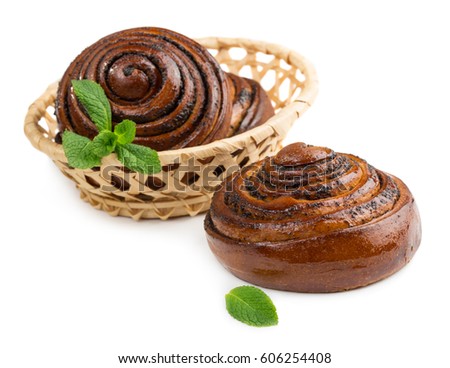 Buns with poppy seeds and green mint leaves isolated on white background
