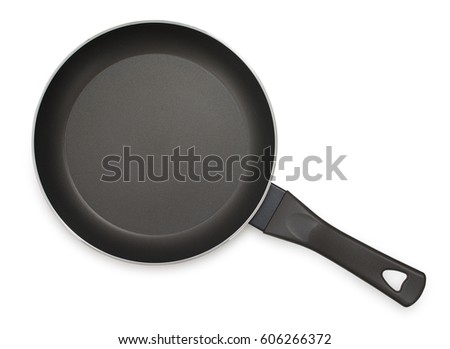 Black frying pan with nonstick surface isolated on white background, close-up, top view. Royalty-Free Stock Photo #606266372