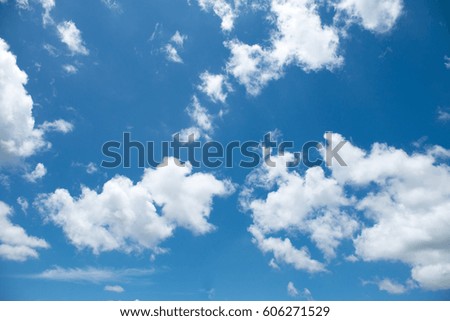 White clouds in the blue sky background.
