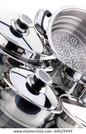 Set of chrome plated aluminum cookware - pots, pans, shot in studio on a white background Royalty-Free Stock Photo #60629449