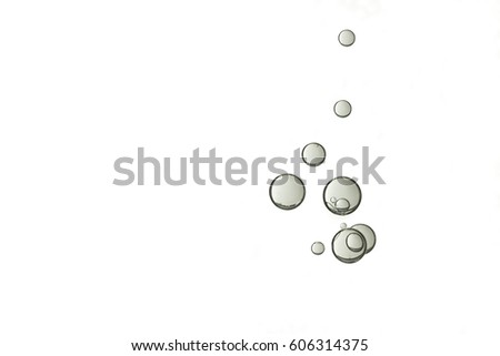 A group of grey air bubbles is isolated over a white background