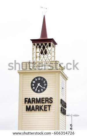 Farmer's market tower with clock on the wall