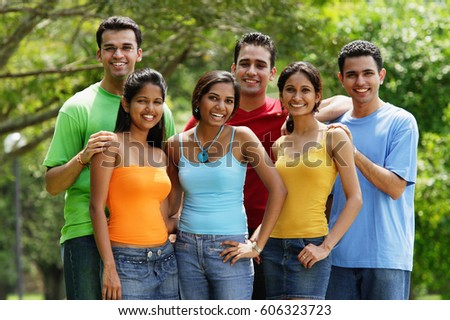 Group of young adults, smiling at camera, portrait