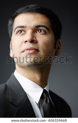 Businessman looking away, portrait