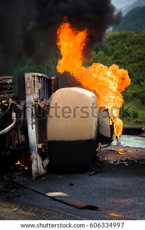 Burning gas tank truck road accident on the track selective focus 