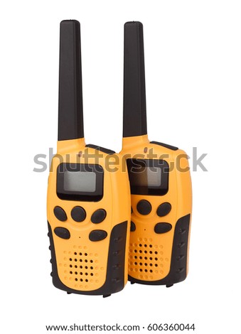 front view of a pair of yellow walkie talkie with black keypad isolated on white background