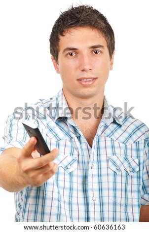 Portrait of young man offering a cell phone isolated on white background