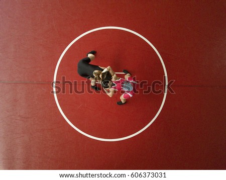 Female wrestlers hand fighting on their feet. View from above. 