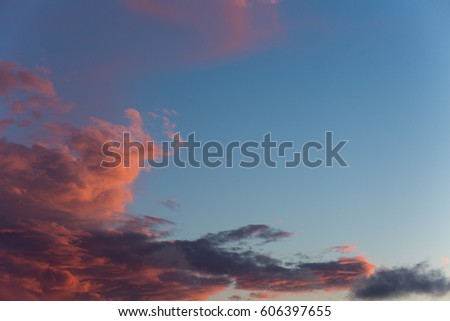 Beautiful, heavy clouded blue sunset sky background.