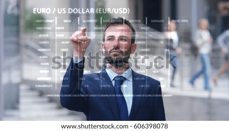 A businessman in a suit uses holography and augmented reality to see in graphics financial economics. Concept: immersive technology, business, economy, futuristic	