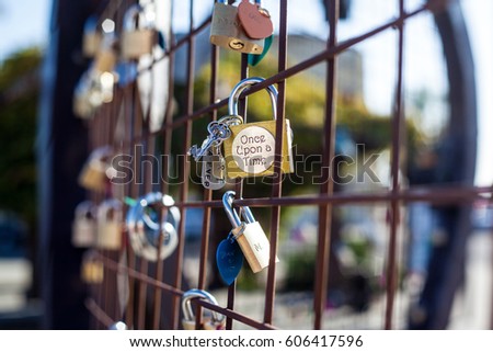 Love lock. Pad lock attached to a heart shaped fence 