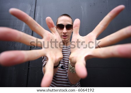 wide-angle shot to give give big hands to a young man