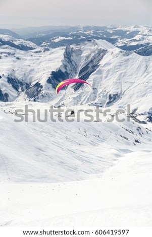 Winter paragliding in Gudauri mountains.