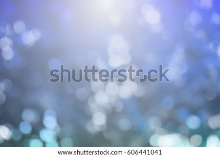 Lights on blue background. holiday bokeh. Abstract. Christmas background Festive abstract background with bokeh defocused lights and stars