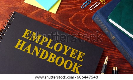 Employee Handbook or manual in a office. Royalty-Free Stock Photo #606447548