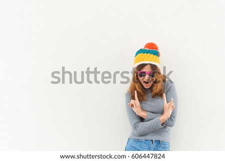 Portrait of hipster girl on white wall,lifestyle of modern teen