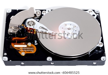 Open hard drive against white background.