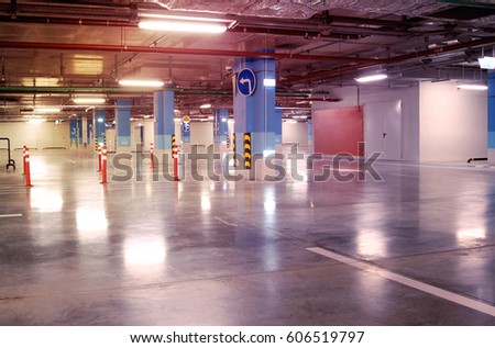 Empty parking garage underground interior in apartment or in supermarket
