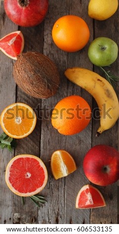 Fresh fruits. Mixed fruits background. Healthy eating, dieting. Background of healthy fresh fruits. Fruit salad - diet, healthy breakfast. pomegranate, persimmon, tangerine, banana, lemon 