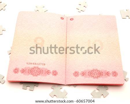 The passport and puzzle on a white background