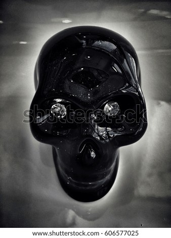 Black skull with  growing abstract background