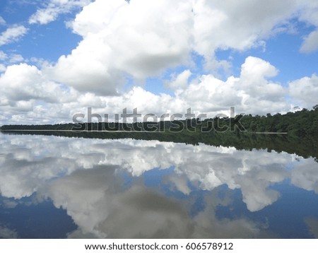 WHERE THE SKY MEETS THE RIVER Royalty-Free Stock Photo #606578912