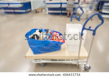 blur picture background  of customer queue for pay money at shopping counter  cashier in furniture mall 
