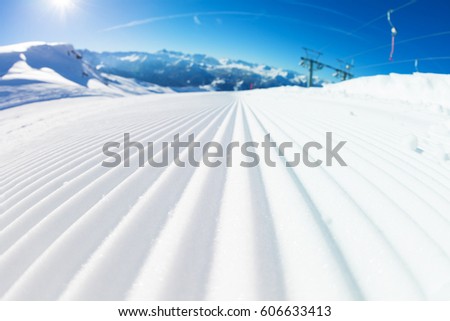 Fresh tracks of snowcat at snowcapped slopes