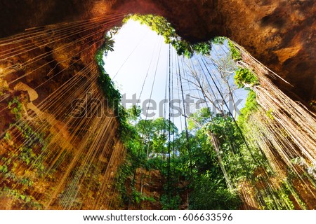 Cenote with lovely opening in the form of heart Royalty-Free Stock Photo #606633596