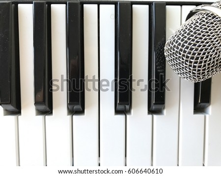 Piano keys with microphone on the right corner (top view, one octave)
