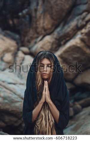 beatiful young wild woman praying