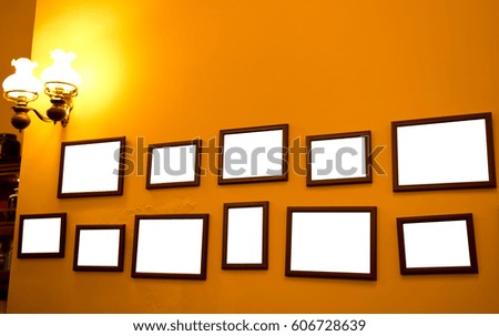 Group of picture frames on the wall.