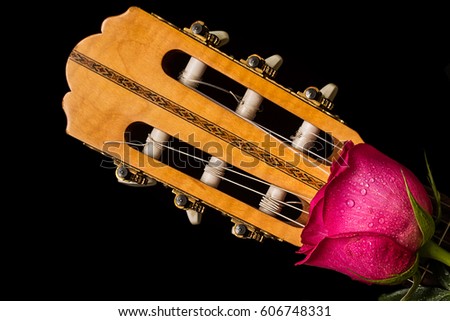 Romantic red roses on guitar, love, valentine concept