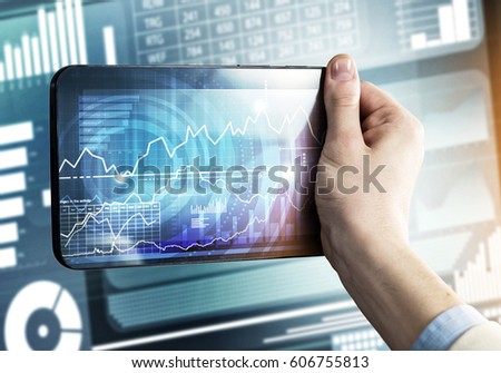 Tablet with infographs in business person hand