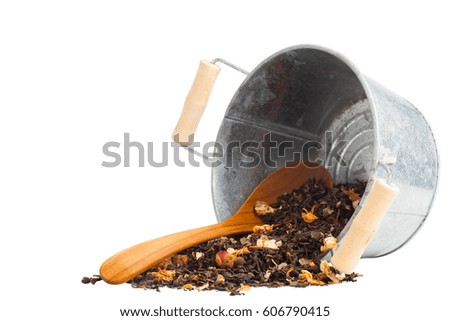 Pile of dried flowers tea leaves with steel bucket and steel bucket. Selective focus on blurry background. with clipping path