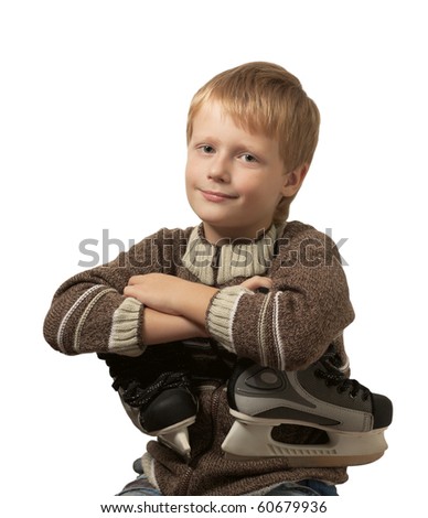 The little boy with the skates in a knitted sweater smiles in camera. Isolated on white background.
