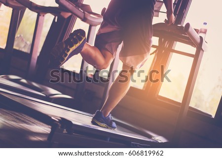 People running in machine treadmill at fitness gym Royalty-Free Stock Photo #606819962