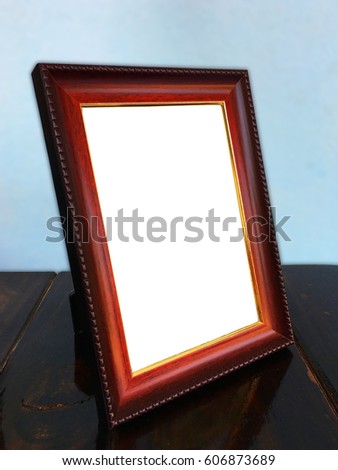 in front of Wooden frame on wooden table