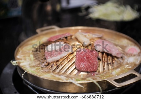 Pork on fire for Korean Barbecue