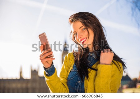 Traveler girl using smartphone